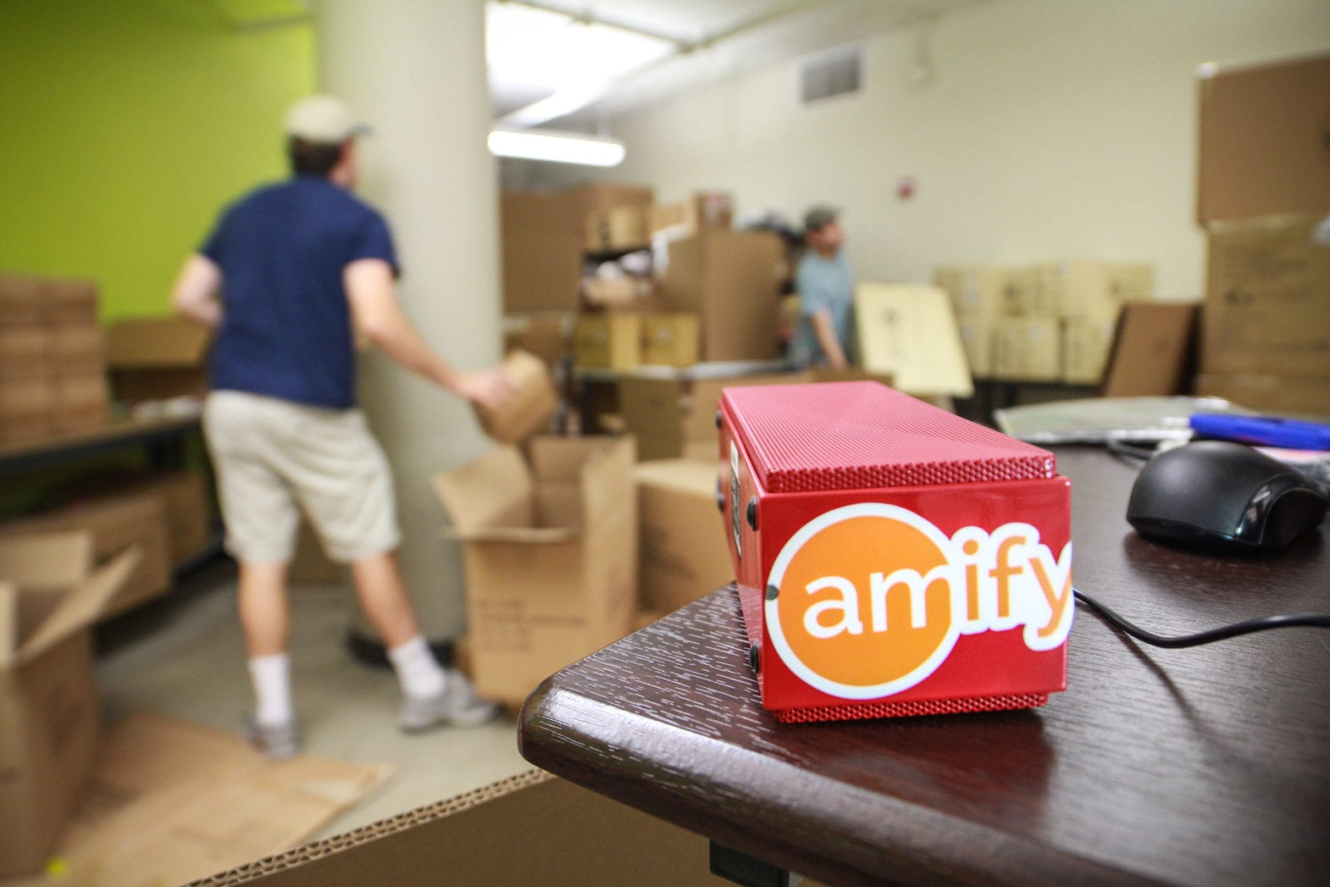 red amify box on wooden table